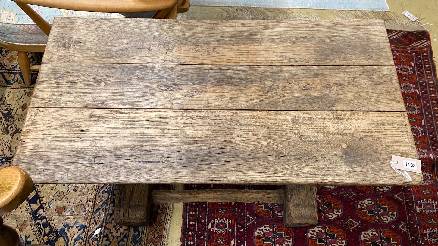 An antique oak coffee table, (altered) width 98cm, depth 52cm, height 51cm